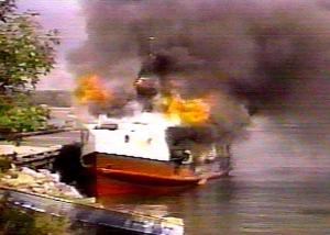 Nawash fishing tug burns in summer of 1995 (screen shot from 5th Estate episode)